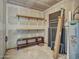 A storage room features shelves, a hot water heater, and some miscellaneous items at 17838 N 45Th Ave, Glendale, AZ 85308