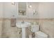 Bathroom featuring a pedestal sink, tile accents, and toilet at 1808 E Hayward Ave # 1, Phoenix, AZ 85020