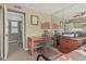 Bedroom with desk/office area, ceiling fan and mirrored wall at 1808 E Hayward Ave # 1, Phoenix, AZ 85020