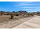 Expansive desert landscape with paved path and mountain views, offering a serene setting for outdoor activities at 1808 E Hayward Ave # 1, Phoenix, AZ 85020