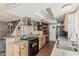 Well-equipped kitchen featuring an island, wood cabinets, granite countertops, and modern appliances at 1808 E Hayward Ave # 1, Phoenix, AZ 85020