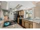 Functional kitchen with wooden cabinets, granite countertops, and stainless steel appliances at 1808 E Hayward Ave # 1, Phoenix, AZ 85020