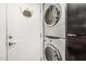 Laundry area with white stackable washer and dryer at 1808 E Hayward Ave # 1, Phoenix, AZ 85020