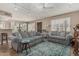 Inviting living room with plush seating, a patterned rug, and abundant natural light at 1808 E Hayward Ave # 1, Phoenix, AZ 85020