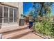 Charming outdoor patio with vibrant flowers, an umbrella, and a grill for entertaining at 1808 E Hayward Ave # 1, Phoenix, AZ 85020