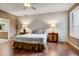 Serene bedroom with hardwood floors, a ceiling fan, plantation shutters and an ensuite bathroom at 19115 E Buckskin Ct, Rio Verde, AZ 85263