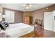 Bedroom with hardwood floors, a ceiling fan, plantation shutters and an ensuite bathroom at 19115 E Buckskin Ct, Rio Verde, AZ 85263