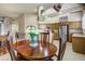 Dining room with a wooden table, chairs, and views of the kitchen and living areas at 19115 E Buckskin Ct, Rio Verde, AZ 85263