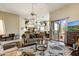Open-concept living room with a ceiling fan, comfortable seating, and access to the kitchen at 19115 E Buckskin Ct, Rio Verde, AZ 85263