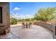Spacious patio offering a tranquil outdoor dining area and desert landscaping at 19115 E Buckskin Ct, Rio Verde, AZ 85263