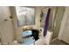 Bathroom with walk-in shower, large window, and safety features at 19976 N 63Rd Dr, Glendale, AZ 85308