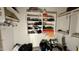 Walk in closet with custom shelving, hanging racks and ample storage at 19976 N 63Rd Dr, Glendale, AZ 85308