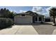 Charming single-story home with a well-maintained front yard and a two-car garage at 19976 N 63Rd Dr, Glendale, AZ 85308