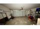 Garage area with a garage door, overhead lighting and ample storage at 19976 N 63Rd Dr, Glendale, AZ 85308