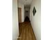 Hallway with wood flooring leading to bedrooms at 19976 N 63Rd Dr, Glendale, AZ 85308