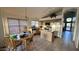 Bright kitchen with island, tile floors, and an adjacent dining area at 19976 N 63Rd Dr, Glendale, AZ 85308