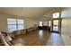Open-concept living room with tile entry, wood flooring, and plenty of natural light at 19976 N 63Rd Dr, Glendale, AZ 85308