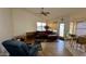 Cozy living area boasts a vaulted ceiling, wood floors, and an exit to the backyard at 19976 N 63Rd Dr, Glendale, AZ 85308