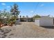 Large backyard with gravel landscaping, shed, and covered patio at 2039 N 12Th St, Phoenix, AZ 85006