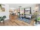 Open concept living space with modern furnishings, wood floors, and access to the kitchen at 2039 N 12Th St, Phoenix, AZ 85006