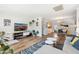 Living space open to kitchen features wood floors, bright decor and modern furnishings at 2039 N 12Th St, Phoenix, AZ 85006
