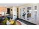 Bright living room featuring french doors, a colorful rug, and comfortable green sofa at 2039 N 12Th St, Phoenix, AZ 85006