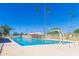 Bright swimming pool area with umbrellas and blue skies at 2039 N 12Th St, Phoenix, AZ 85006