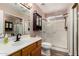 Well-maintained bathroom with shower stall, vanity, and storage cabinet at 20717 N 104Th Ln, Peoria, AZ 85382