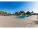 Community pool with a ramada featuring mature desert landscaping with a fenced perimeter at 20717 N 104Th Ln, Peoria, AZ 85382