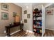 This office has decor, a book shelf, a neutral colored wall, and wood floors at 20717 N 104Th Ln, Peoria, AZ 85382