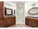 Beautiful bathroom with dual vanities, granite countertops, and a glass-enclosed shower at 20801 N 90Th Pl # 210, Scottsdale, AZ 85255