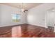 Spacious bedroom with gleaming hardwood floors and large window with pleasant views at 20801 N 90Th Pl # 210, Scottsdale, AZ 85255