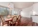 Hardwood floor open concept with large window and ceiling fan near dining room at 20801 N 90Th Pl # 210, Scottsdale, AZ 85255