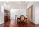Elegant dining room featuring rich hardwood floors, pendant lighting, and comfortable seating at 20801 N 90Th Pl # 210, Scottsdale, AZ 85255