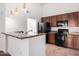 Modern kitchen features granite countertops, stainless steel appliances, and ample cabinet space at 20801 N 90Th Pl # 210, Scottsdale, AZ 85255