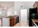 Stylish kitchen with granite countertops, stainless steel appliances, and wood cabinetry at 20801 N 90Th Pl # 210, Scottsdale, AZ 85255