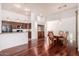Open-concept space with hardwood flooring, modern kitchen, and elegant dining area at 20801 N 90Th Pl # 210, Scottsdale, AZ 85255
