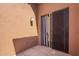 Cozy patio provides a spot for relaxation, featuring a stucco wall and sliding door at 20801 N 90Th Pl # 210, Scottsdale, AZ 85255