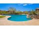 Inviting community pool area with ample seating and lush desert landscaping at 20801 N 90Th Pl # 210, Scottsdale, AZ 85255