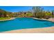 Inviting community pool area with ample seating and desert landscaping at 20801 N 90Th Pl # 210, Scottsdale, AZ 85255