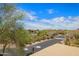 Street view of desert landscape with beautiful blue skies and gorgeous clouds overhead at 20801 N 90Th Pl # 210, Scottsdale, AZ 85255