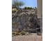 The landscaped backyard features desert plants and gravel, providing a low-maintenance outdoor space at 2233 E Behrend Dr # 211, Phoenix, AZ 85024