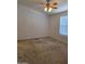 Neutral bedroom features a ceiling fan and a window at 2233 E Behrend Dr # 211, Phoenix, AZ 85024