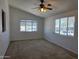 Bright bedroom with neutral carpet and ample natural light from two windows at 2233 E Behrend Dr # 211, Phoenix, AZ 85024