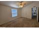 This bedroom offers a ceiling fan, window, and closet at 2233 E Behrend Dr # 211, Phoenix, AZ 85024