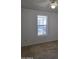Bright bedroom featuring a window overlooking the front yard at 2233 E Behrend Dr # 211, Phoenix, AZ 85024