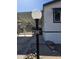 Home exterior showcasing the house number, covered parking, and desert landscaping at 2233 E Behrend Dr # 211, Phoenix, AZ 85024