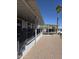 Home's exterior showcasing covered parking, steps, and easy care desert landscaping at 2233 E Behrend Dr # 211, Phoenix, AZ 85024