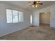 Inviting living room with neutral carpet and a bright, airy feel at 2233 E Behrend Dr # 211, Phoenix, AZ 85024