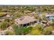 Desert home featuring a swimming pool, outdoor kitchen, lush landscaping, and desert surroundings at 22469 N 79Th Pl, Scottsdale, AZ 85255